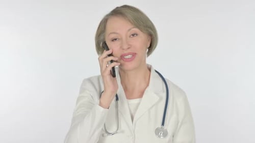Doctor Talking on Cell Phone Wearing White Coat