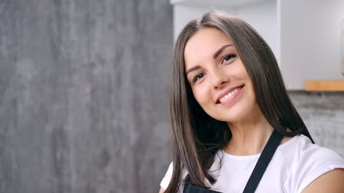Smiling Woman Portrait in Bright Kitchen