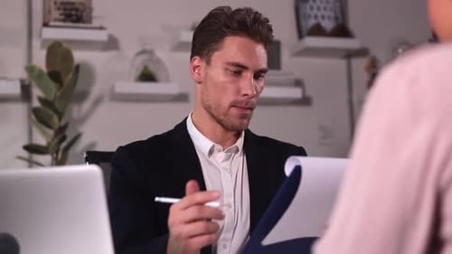 Man and Woman Talking During Hr Interview at Table in Modern Office Spbi