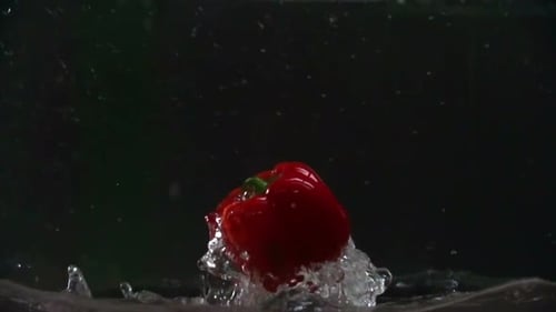 Red Pepper Dropping into Water