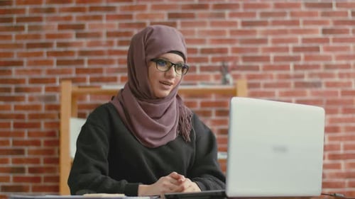 Woman with Headscarf on Video Conference Call