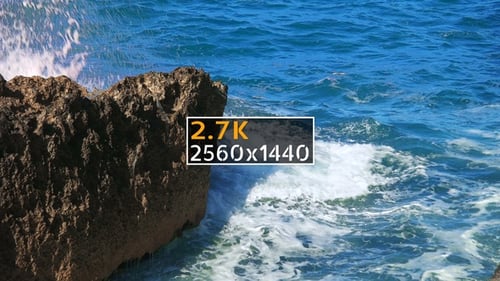 Ocean Waves Crashing Against Rocky Shoreline