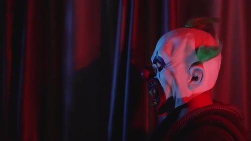 Sinister Clown in Mask Turning Head