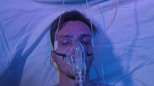 Coronavirus Male Patient On Respiratory Medical System In Hospital