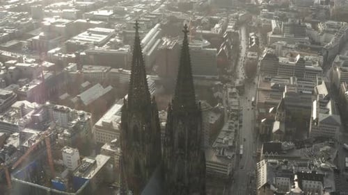 Aerial Slide and Pan Shot of Pair of Towers of Gothic Cathedral Church of Saint Peter