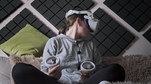 Young Woman Using VR Headset at Home