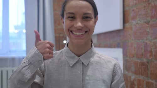 Thumbs Up by Hispanic Woman, Positive gesture