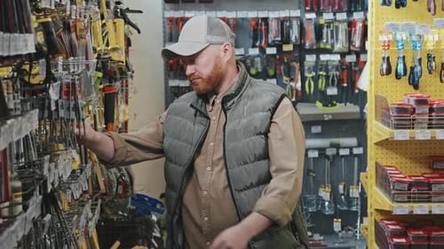 Guy Shopping at Hardware Store