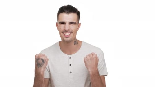 Man Smiling and Pumping Fists on White Background