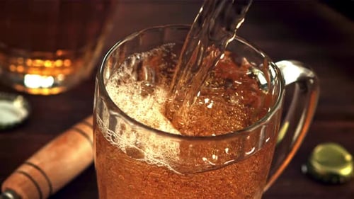 Amber Beer Pouring Into a Mug Close Up