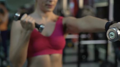 Fit Woman Doing Dumbbell Exercises, Training in Gym for Strength and Health