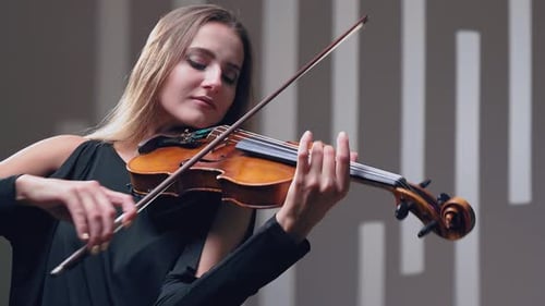 Girl Violin Playing at Studio, Woman Is Practicing Playing Musical Instrument