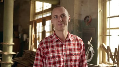 Adult Man Smiling in a Workshop