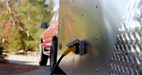 Trailer with Electrical Cord Plugged In Outdoors