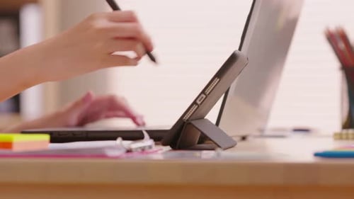 Close up female professional point out the tablet screen and drawing online business at screen. Dig