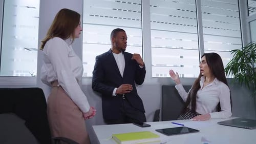Diverse Colleagues Meeting at Modern Office