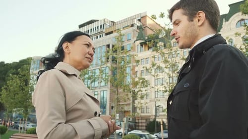 Business Conversation Between Woman and Young Man