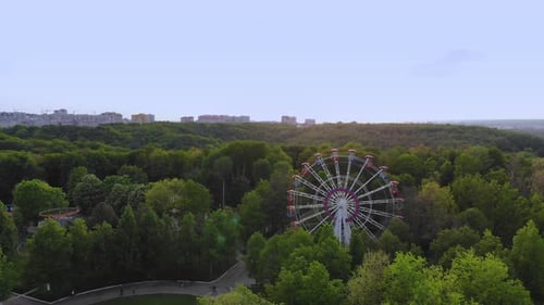 Ferris Wheel on Blue Sky Background. Cityscape Panoramic View