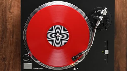 Red Vinyl Spinning on Turntable Overhead Shot