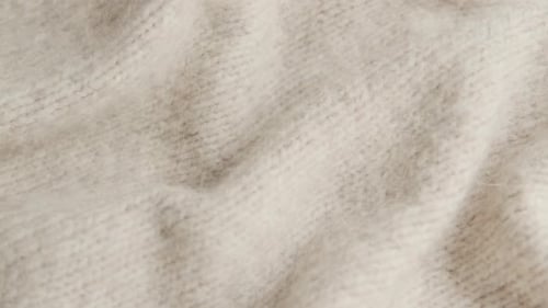 Knitted Beige Fabric in a Close Up Shot