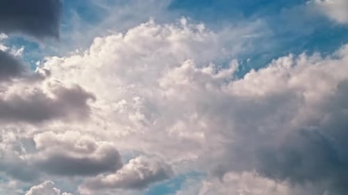 Clouds Drifting Across a Deep Blue Sky