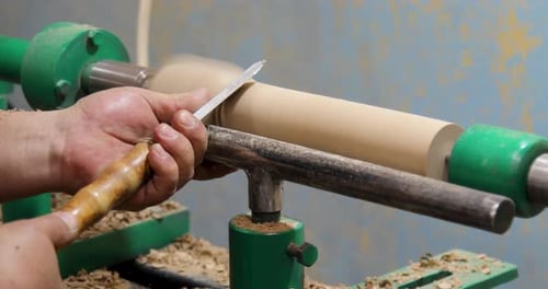 Craftsman Shapes Wood on Lathe with Sharp Tool