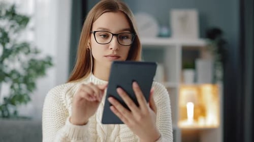 Woman Using Tablet Device Indoors