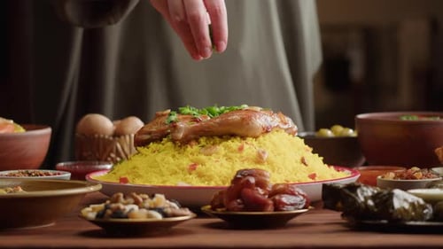 Decorating Rice and Meat Dish with Sprinkled Greens