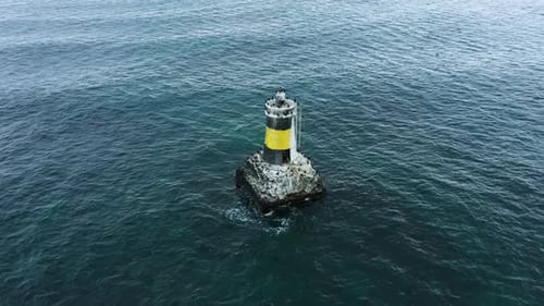 Aerial view of lighthouse in the sea