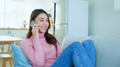 Woman Relaxing at Home Talking on Cellphone