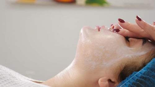 Wellness and Beauty Salon. Relaxing and Health. Spa Woman Facial Massage. Female Enjoying Relaxing