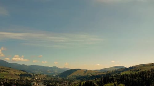 Aerial View of Green Hills and Mountains