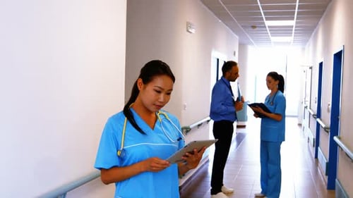 Nurse holding digital tablet in hospital
