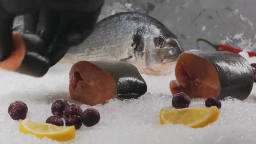 Fresh Fish on Ice with Lemon and Berries