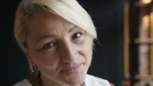 Blonde Woman Smiling Directly At Camera Close Up