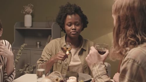 Friends Enjoying Wine and Dinner Together