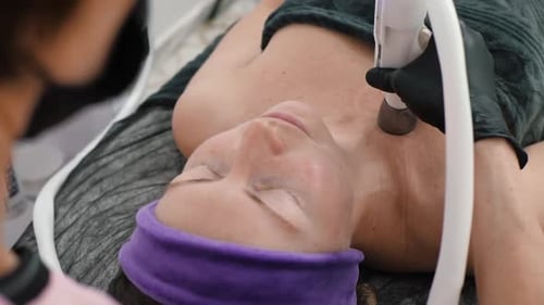 Woman Receiving Beauty Treatment From Professional