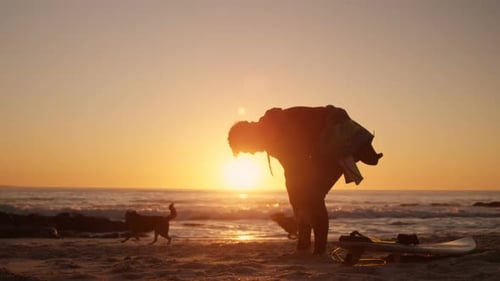 Man wearing wetsuit in the beach