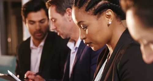 Business Professionals Working Together at Table