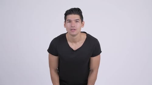 Happy Young Handsome Multi-ethnic Man Getting Good News