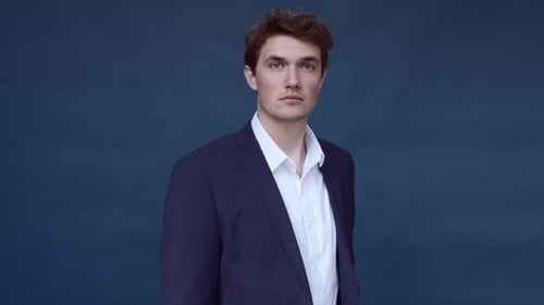 Man in Navy Suit Jacket Smiling