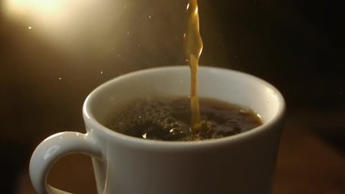 Coffee Pouring into White Mug Close Up