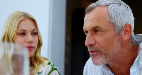 Friends interacting with each other in restaurant