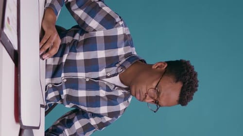 Focused Adult Working at Computer Needs Assistance