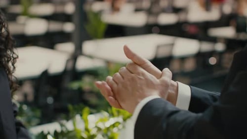 Unrecognizable Female Sparying Sanitizer On Businessman's Hands In Office Cropped