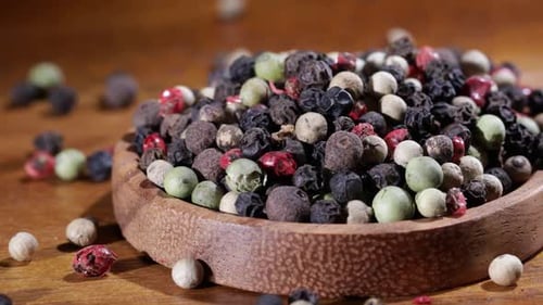 Colorful Mix of Peppercorns in Wooden Bowl