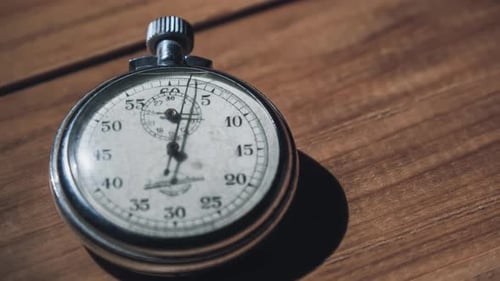 Timelapse of Antique Stopwatch Lies on Wooden Table and Counts the Seconds