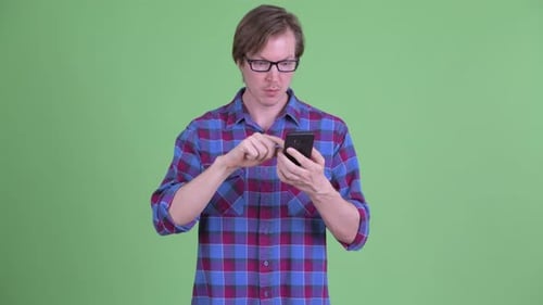 Young Adult Man Reacts to Phone Message