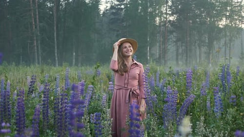 Woman in Dress Waving in Rural Flower Field