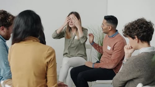 Distraught Woman Talking in Therapy Group